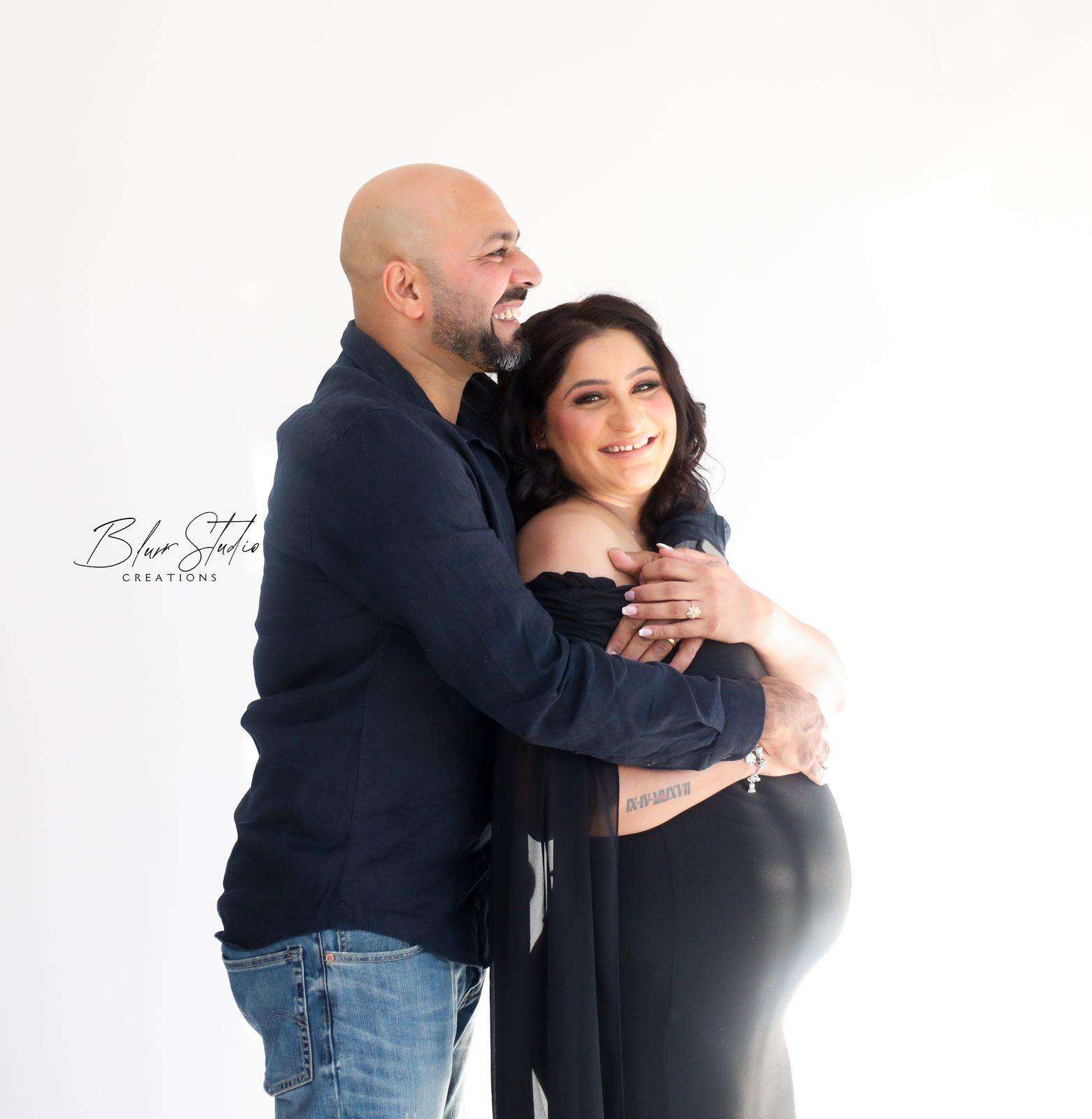 Maternity — laughing couple