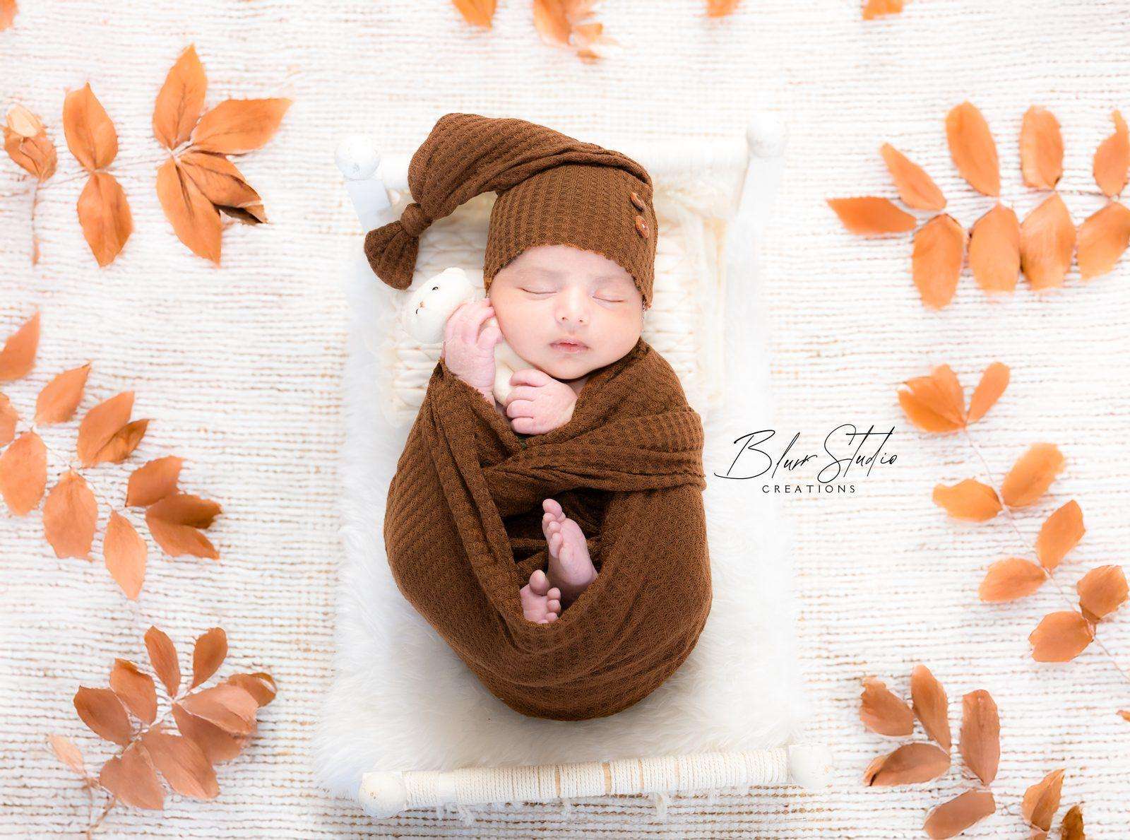 Newborn — autumn leaves